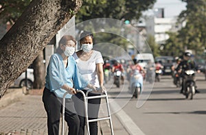 Elderly woman wearing mask for protect air pollution