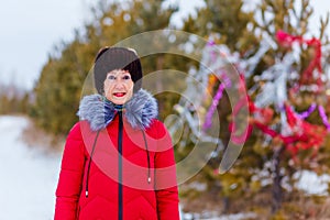 An elderly woman in the winter at Christmas