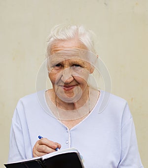 Elderly woman with worksheet
