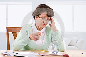 Elderly woman worry about bill notice