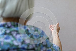 Elderly woman, wrinkled hand palm. Old lady`s hand. Elderly lady is waiting for help. Elderly concept with light