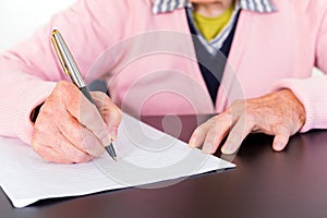 Elderly woman writing