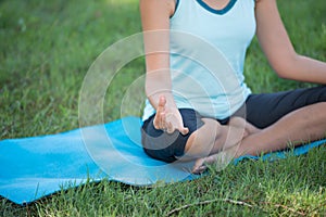 Elderly woman with yoga exercise outdoors at the park. Health an