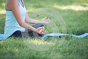 Elderly woman with yoga exercise outdoors at the park. Health an