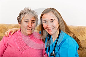 Elderly woman and young caregiver