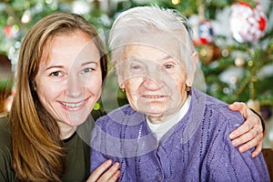 Elderly woman and young carer
