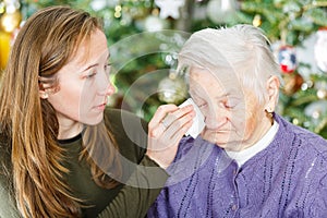 Elderly woman and young carer