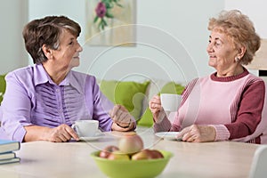 Elderly women drinking coffee
