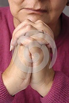 An elderly women having a peaceful moment