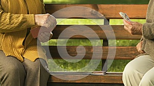 Elderly women playing cards in park, entertainment for pensioners, hobby closeup