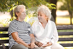 Elderly women resting on bench