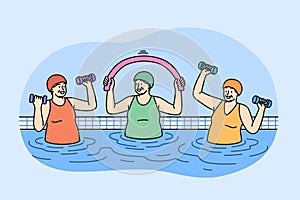 Elderly women working out in pool doing aqua fitness and lifting dumbbells to improve health