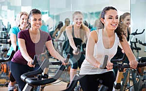 Elderly and young women working out hard