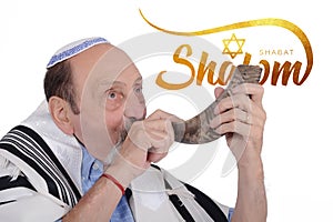 Eldery jewish man blowing the Shofar horn for Rosh Hashanah