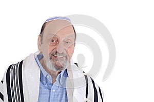 Eldery jewish man wrapped in talit praying photo