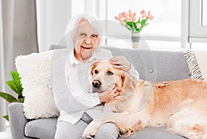 Eldery woman with golden retriever dog