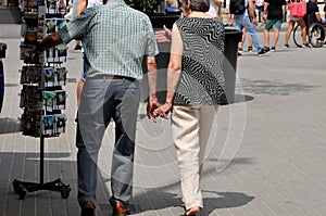 ELDLERY COUPLE HLDING HANDS IN ARCELONA SPAIN