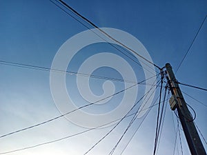 Electeic and Telephone Pole with Blue Sky