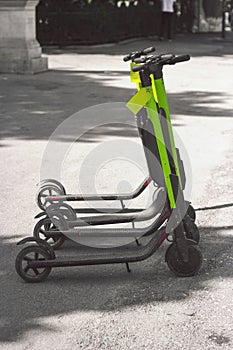 Electic scooters parked on the street, with copy space