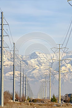 An Electicity posts against snowy Mount Timpanogos