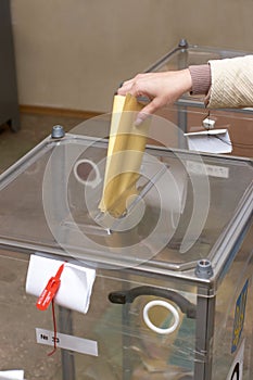 Election: ballot box and hand