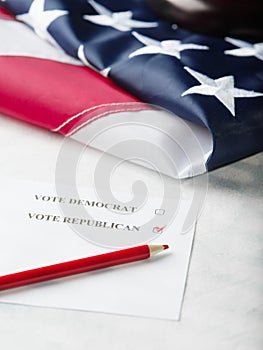 Election campaign. Vote for Democrats and Republicans. parliamentary elections. American flag and piece of paper, red pencil.