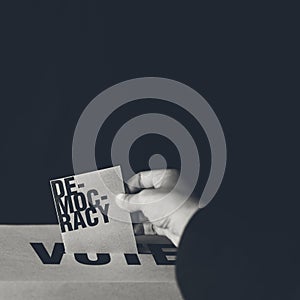 Election card insert in vote box, democracy concept