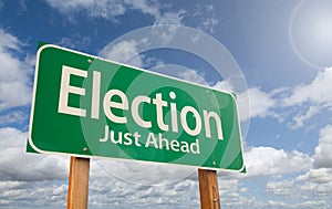 Election Just Ahead Green Road Sign Over Clouds and Blue Sky