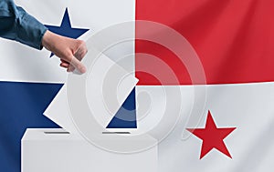 Elections, Panama. Voting concept. A hand throws a ballot into the ballot box. Panama flag on background