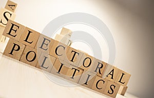 Electoral politics Word from wooden cubes. Economy state government terms