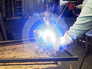 Electric arc welding sparks. Metal processing