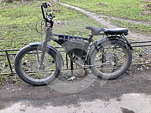 electric bicycle with large thick wheels in road dust