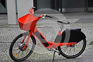Electric bicycle to rent parked in pedestrian area