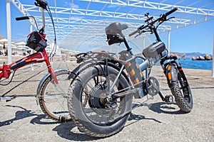 Electric bikes on the beach by the sea