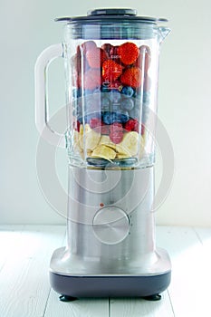 Electric blender with berries