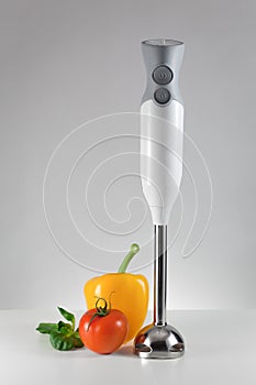 Electric blender and fresh vegetables