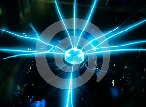 Electric blue beam spread from the middle ball Science dignitaries