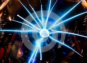 Electric blue beam spread from the middle ball Science dignitaries