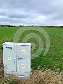 Electric box at an empty field, new construction concept