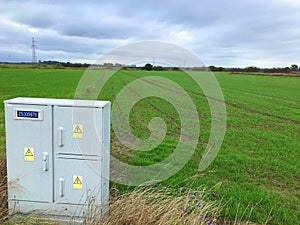 Electric box at an empty field, new construction concept