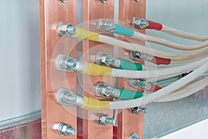 Electric bus bars connected to it by wires or cables.