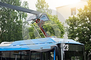 Electric bus is charged by pantograph