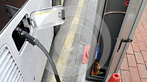 Electric bus charging battery from power generated point on street in south Korea