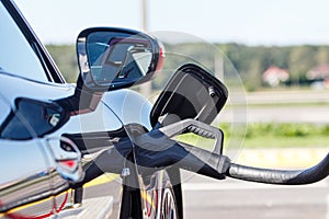 Electric Car charge with cable in fast charging station