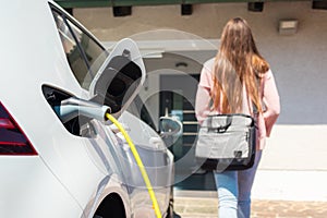 Electric car charger plugged in