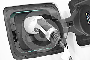 Electric car charging detail. Green and renewable energy technology.