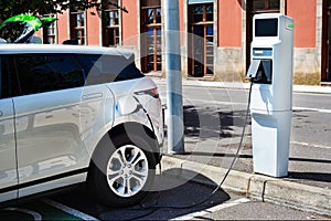 Electric car charging at a modern gas station