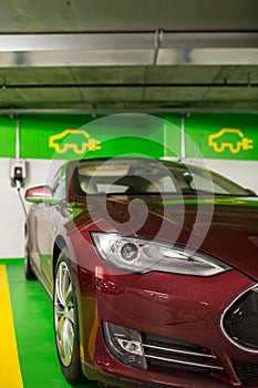 Electric car at a charging point in an underground parking