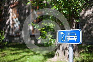 Electric car charging spot traffic sign in blue and white