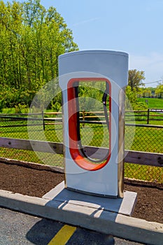 Electric car charging station in parking lot